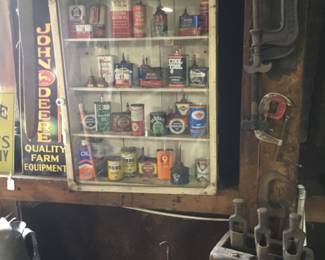 176. Many oil cans, rustic cabinet