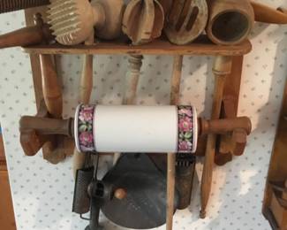 235. Kitchen rack with tools including rolling pin.