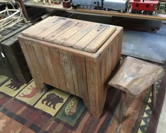 16. Wooden ice box, milking stool, train in background