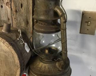 23. Lantern next to barrel