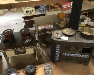49. Toy stoves, pots etc.