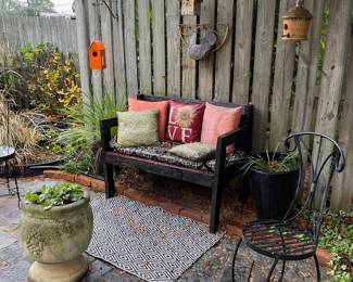 Outdoor sitting area; birdhouses; decor and planter; metal chair