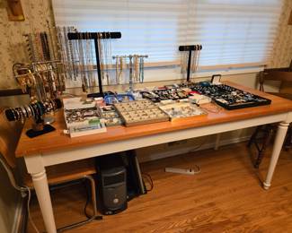 Much jewelry.  Farm style table.