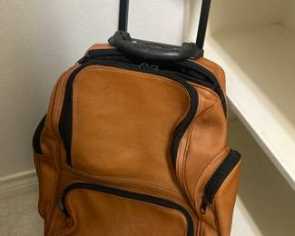 Handsome leather rolling luggage/backpack