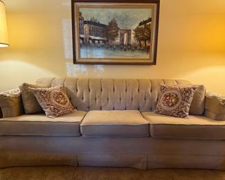 Comfortable 3-Cushion Living Room Couch with a classic design, perfect for relaxing or entertaining.