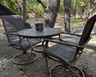 Metal, glass, and mesh fabric patio table