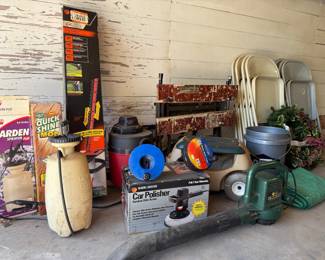 Garden tools like weed trimmer, shrub trimmer, garden sprayers. Shopvac, folding metal chairs, Workbench with vice grip, and a car polisher