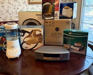 Bose Stereo Radio and CD player, Clothes Steamers, Robot automatic vacuum, Keurig Coffee Maker, New Oster Toaster, Single Burner, George Forman Grill, Cuisinart Blender and more
