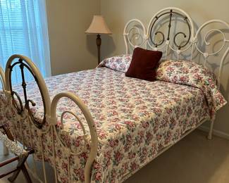 antique iron bed with brass accents 