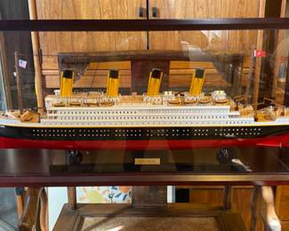 Model Titanic ship in glass case
