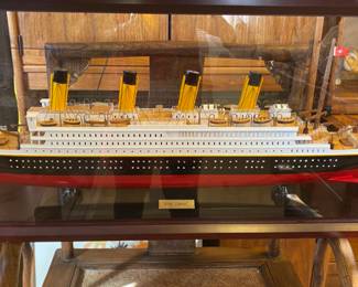 Model Titanic ship in glass case
