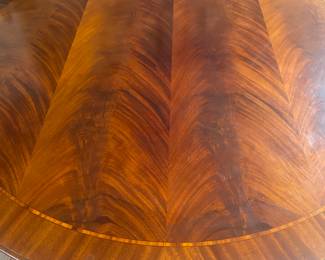 Round mahogany dining table w/5 crescent shaped leaves
