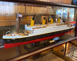 Model Titanic ship in glass case