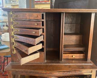 Antique oak dental cabinet with swing out drawers