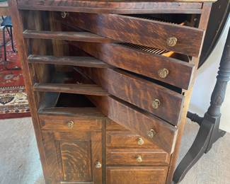Antique oak dental cabinet with swing out drawers