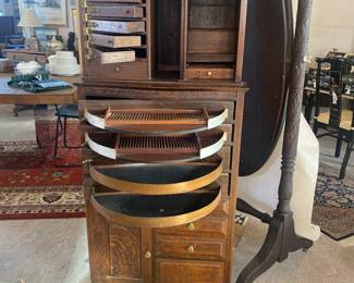 Antique oak dental cabinet with swing out drawers