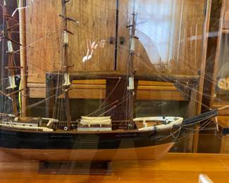 Vintage model ship in clear plexiglass case