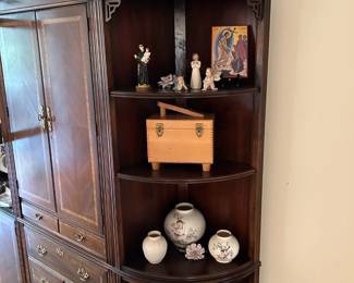 An incredible wall storage unit with multiple display areas, drawers and shelves.