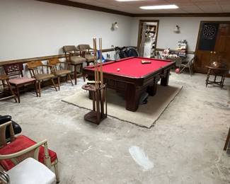 Pool table and lots of accent / sitting chairs.