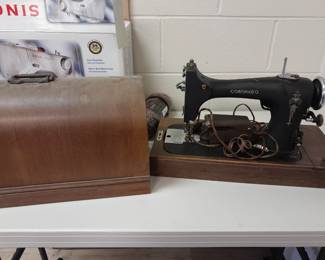 Vintage sewing machine with wood case