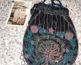 A vintage purse with a vintage picture of the original owner with the purse.
