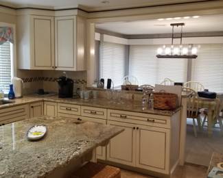 KraftMaid kitchen cabinetry detail; includes pull-out trash corral