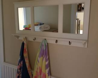 Wall mirror with hooks