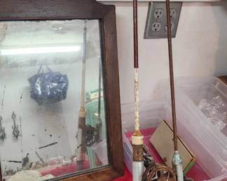 Antique mirror and fishing rods