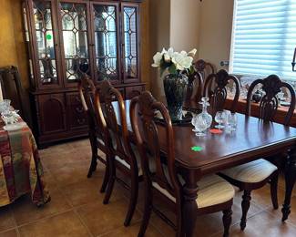 Beautiful Lexington China cabinet and dining room table with 8 chairs and two leaves