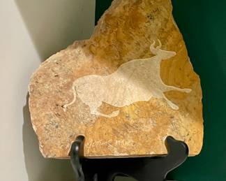 Signed by the artist in the style of a petroglyph