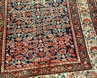 Malayer Persian, Central Iran early 20th century runner. Wool on cotton.  The field is decorated with an all over herati design on a deep navy ground. The main border in ivory, patterned with alternating stylized floral motifs.  Minor borders in navy.  Measurements: 15'10" L x 3'6" W