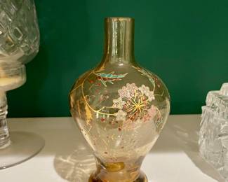 Emile Galle, France.  Amber glass, finely enameled hand painted floral design with leafy stems, ground and polished pontil, signed lower side. Circa mid to late 19th century.  Measurements 6 1/2" H  one of a pair. 