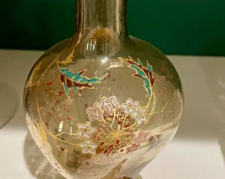 Emile Galle, France.  Amber glass, finely enameled hand painted floral design with leafy stems, ground and polished pontil, signed lower side. Circa mid to late 19th century.  Measurements 6 1/2" H  one of a pair. 