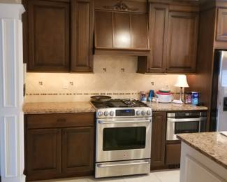 Kitchen cabinetry detail; BROAN range hood