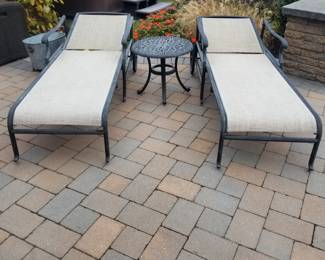 Chaise lounges; cast aluminum accent table