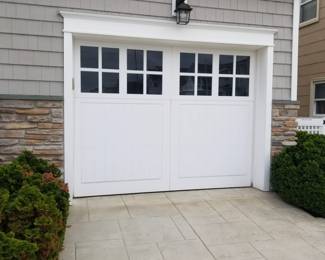 Insulated garage door is 9 ft. wide x 7 ft. tall