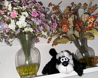 lonely critter amidst the faux flowers