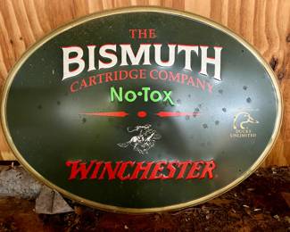 Winchester oval metal sign