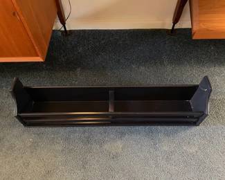 Black wooden shelf.
