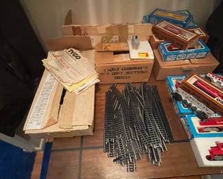 Assorted model trains with tracks.