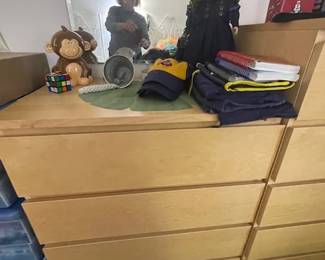 Beige chest of drawers.