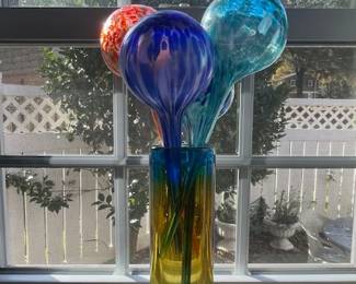 Watering balls in vase.