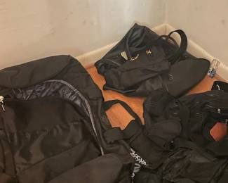 Assorted backpakcs carrying casses.