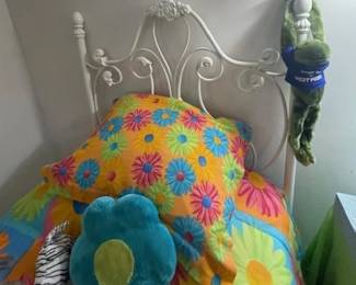 Pair of white iron beds and pair of vintage groovy bedspreads.