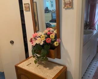 End table and mirror with planter.