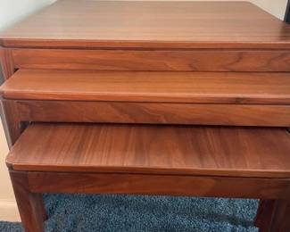 Set of teak stacking tables.