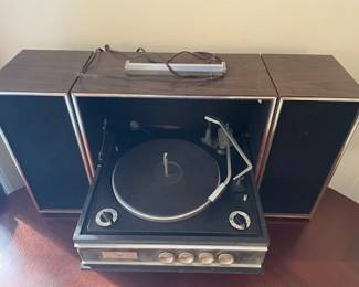 Vintage portable Admiral record player with speakers.