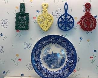 Collector plate and colorful trivets.