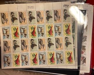 Large selection of postage stamps (full sheets, uncirculated).