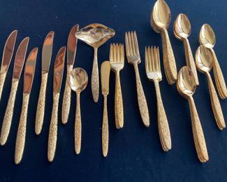 42 pieces of gold toned dinnerware